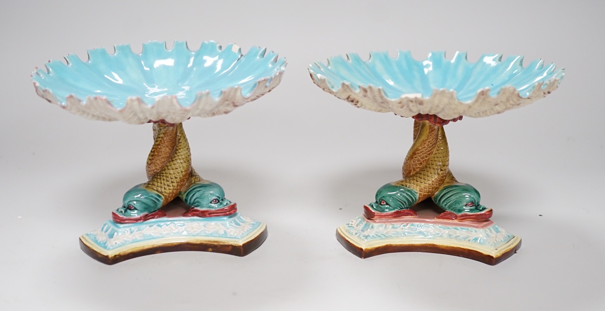 A pair of late 19th century Royal Worcester majolica dolphin comports, 10cm tall